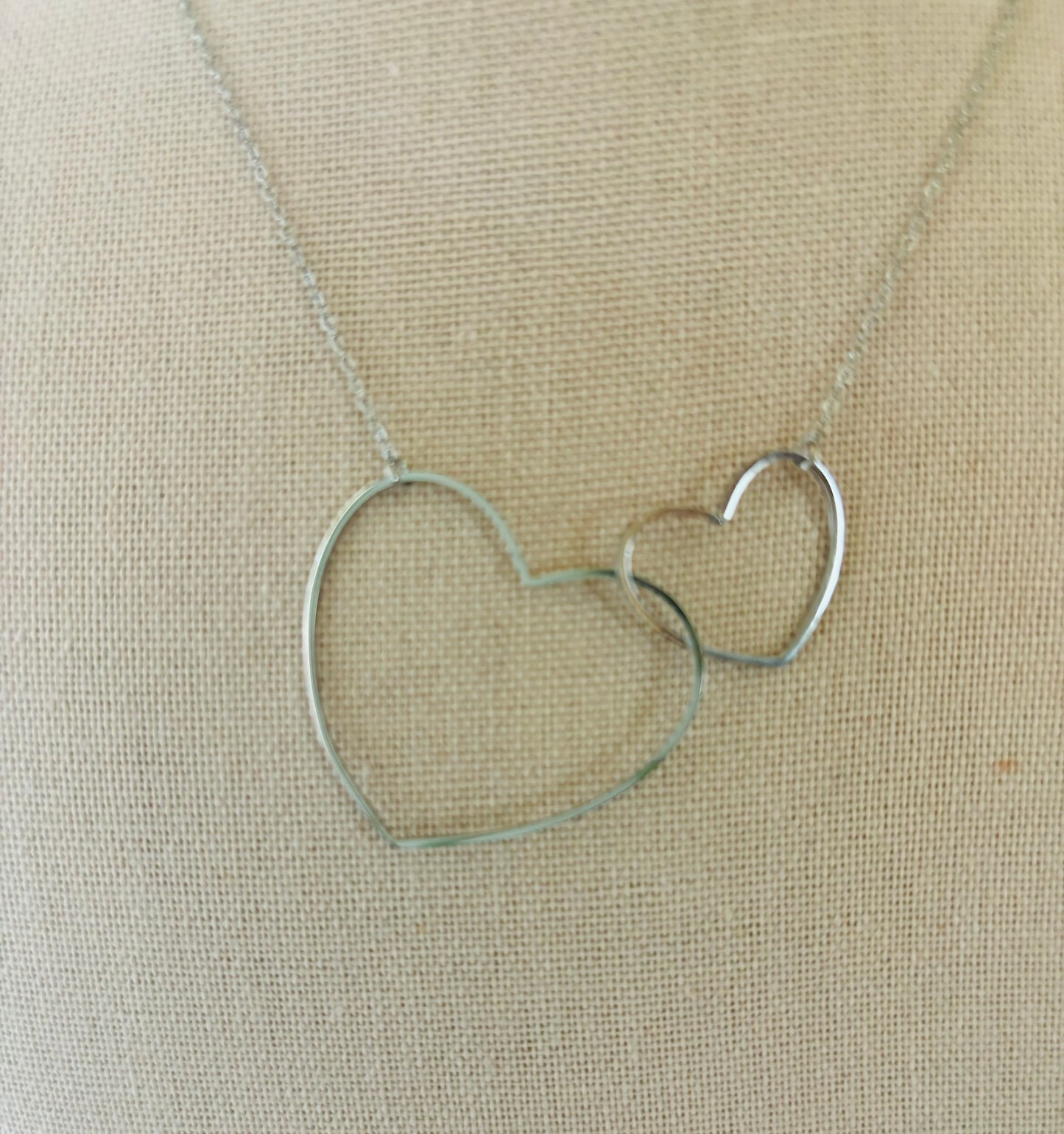 Two crossed hearts pendant necklace